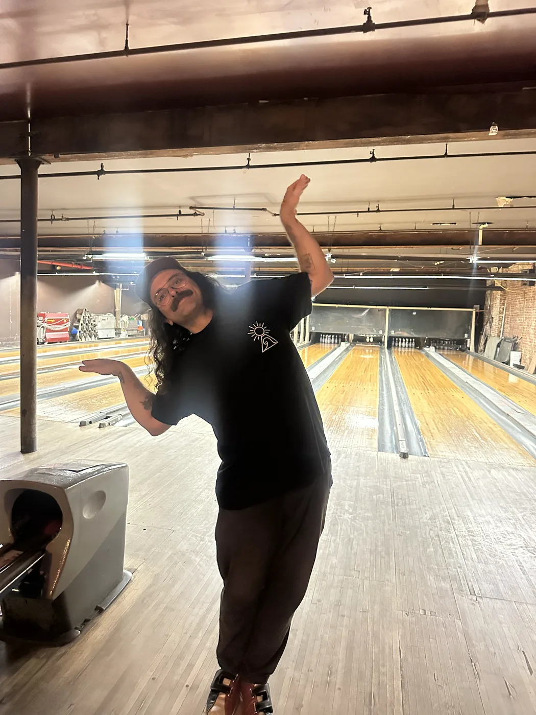 Striking a pose at a bowling alley