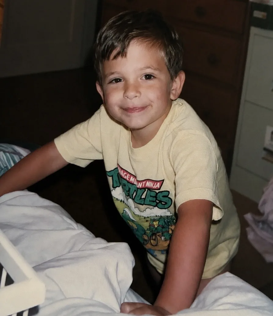 Me as a kid in a Teenage Mutant Ninja Turtles t-shirt